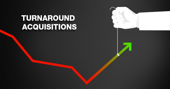 Turnaround acquisitions. Hand is pulling up a trend line out of the red.