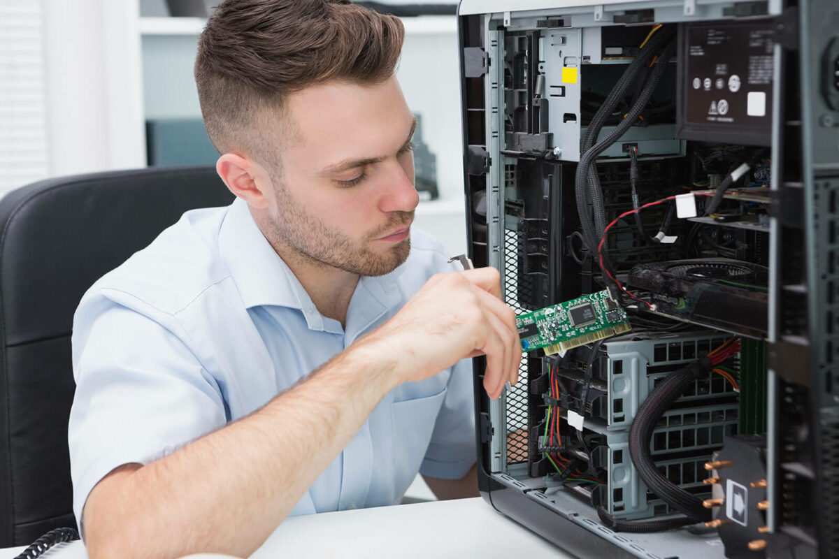 Man working on the inside of a computer.